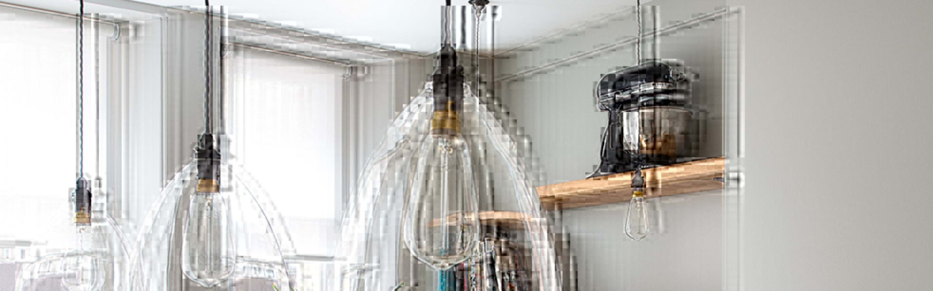 Handblown Ledbury clear glass pendant lights in a bespoke kitchen