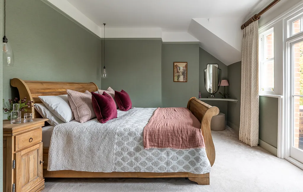 Stylish bedroom lighting featuring twin Upton pendant lights on either side of a wooden bed.