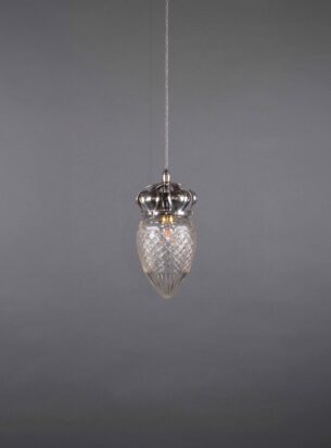 A cut glass pineapple pendant with Arts and crafts silver plated ornate gallery against a dark grey background and photographed from a distance to reveal the twistflex and glass details whilst switched off.